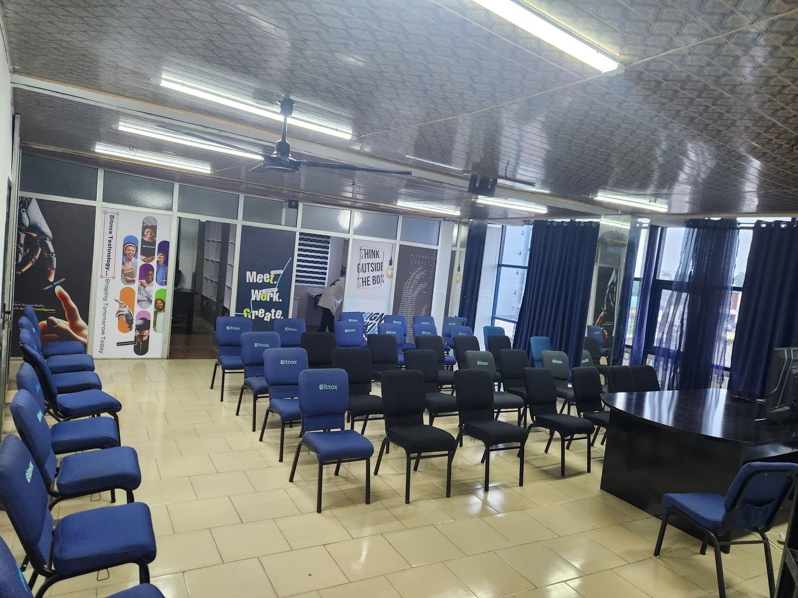 The main hall laid out with rows of Bitnox chairs ahead of a session.